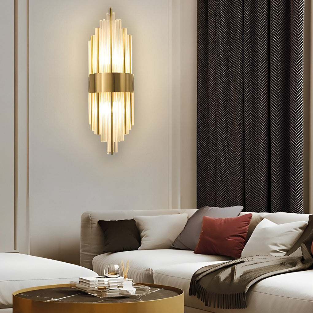 Gold and crystal wall sconces with a sleek design, illuminating a contemporary interior.