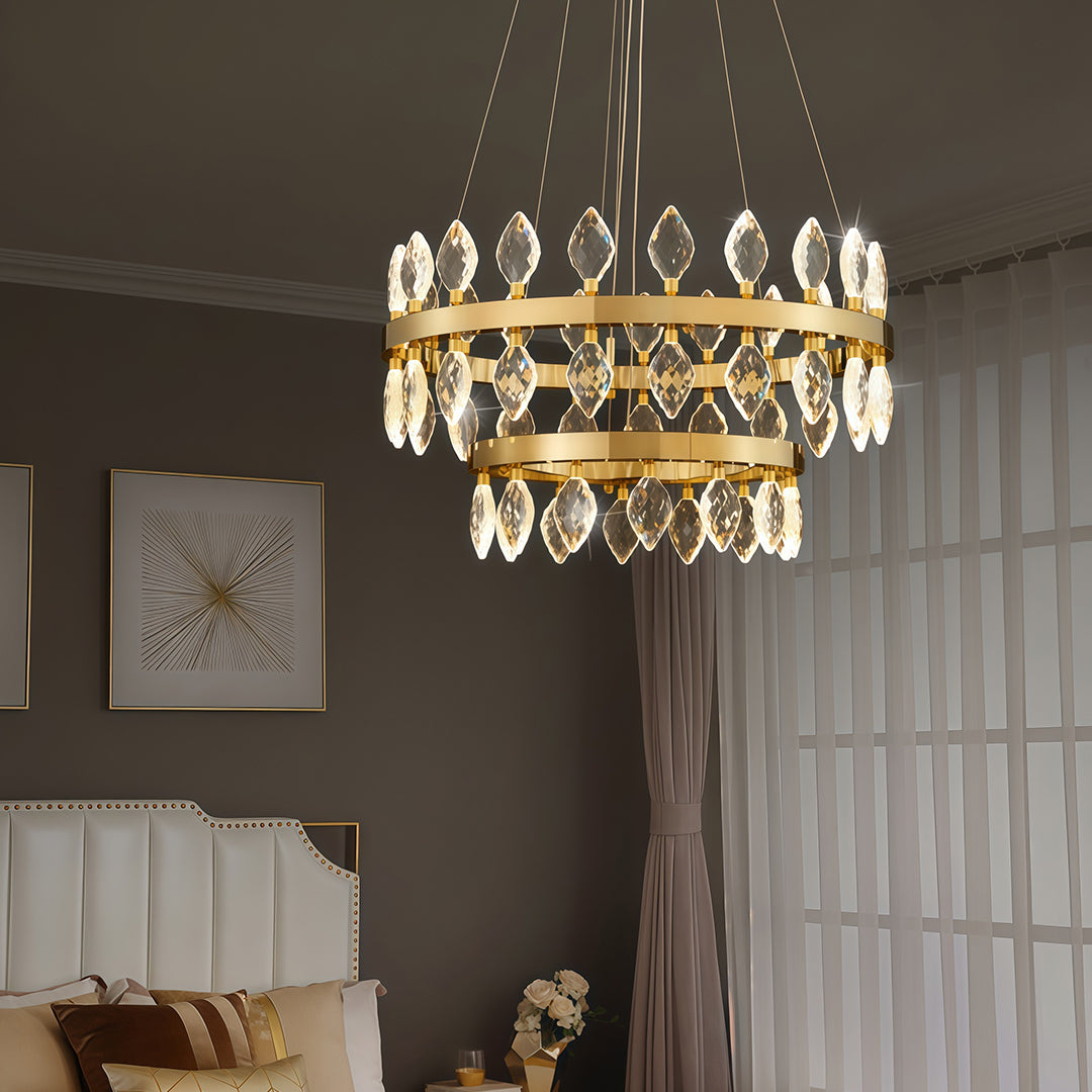 Gold Crystorama chandelier illuminating a cozy bedroom.