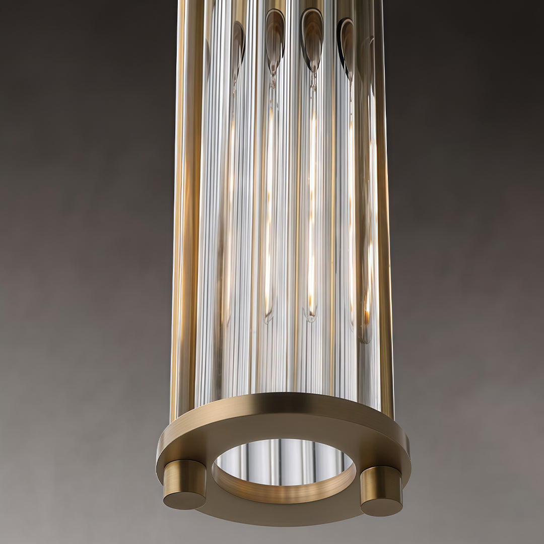 Detailed view of gold cylinder pendant light ceiling canopy.