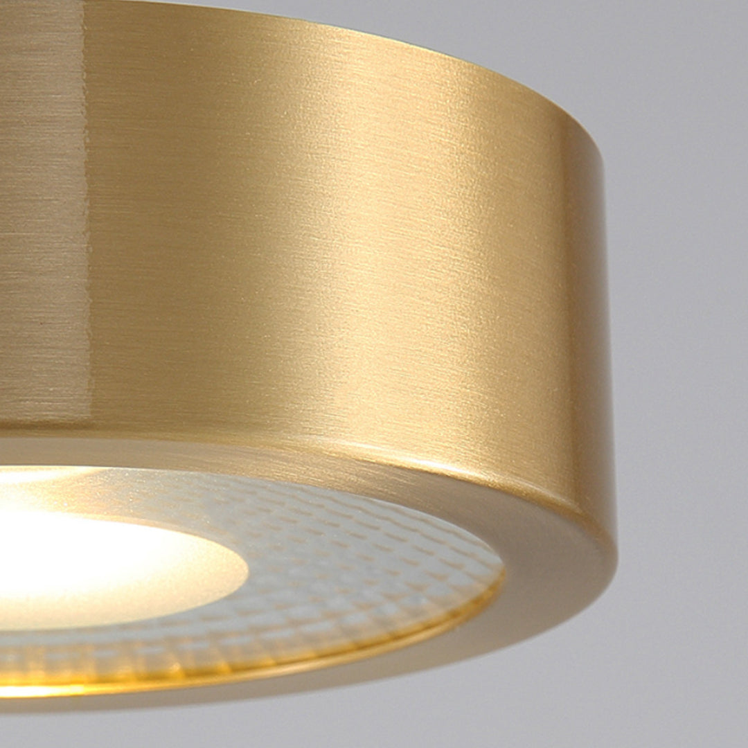 Close-up detail of gold downlight housing with brushed metal finish.