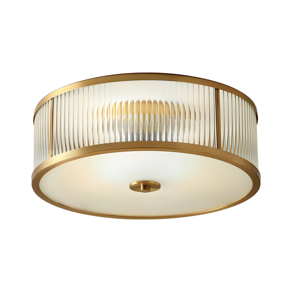 Gold drum ceiling light with a close-up of its cylindrical gold structure.