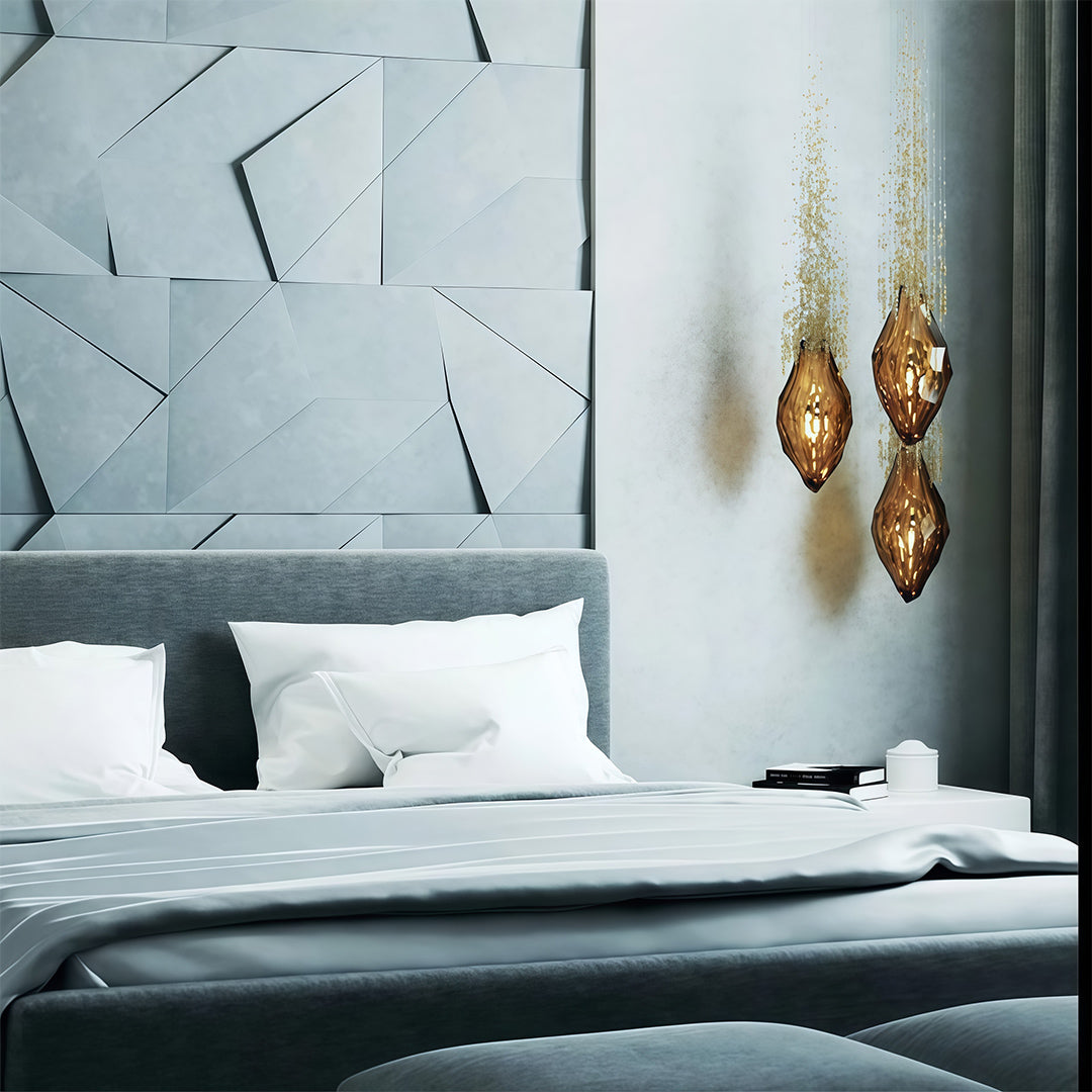 Gold pendant stairway chandelier lighting used above bedside in modern bedroom.