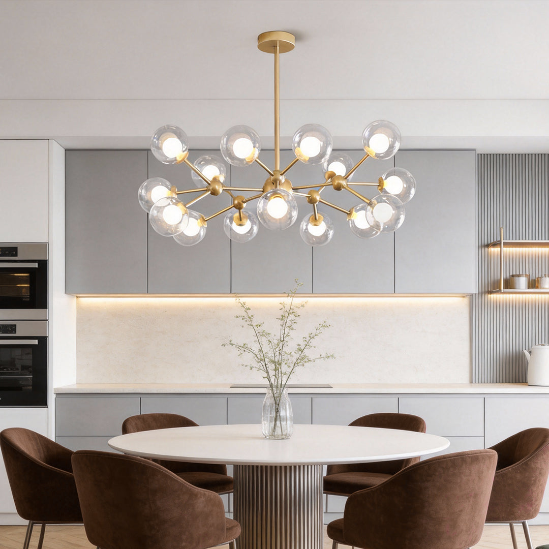 Modern dining room illuminated by a gold glass sputnik light with clear globe bulbs and elegant linear arms.