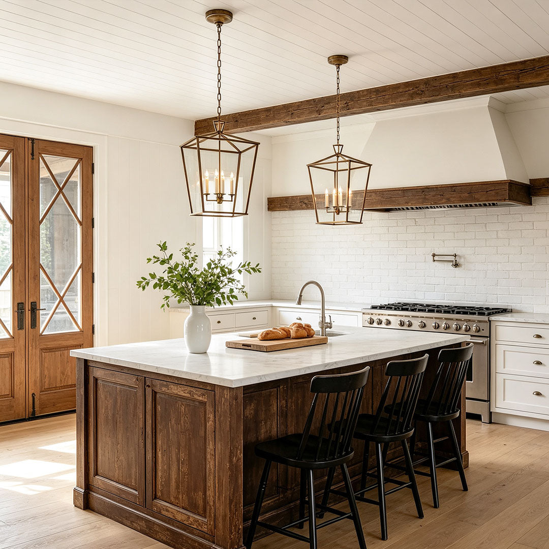 Gold lantern chandelier hanging above a rustic kitchen island with farmhouse interior design.