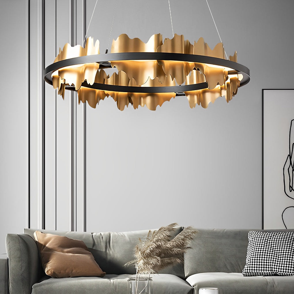 Gold leaf chandelier with a black and gold finish, enhancing a contemporary space.