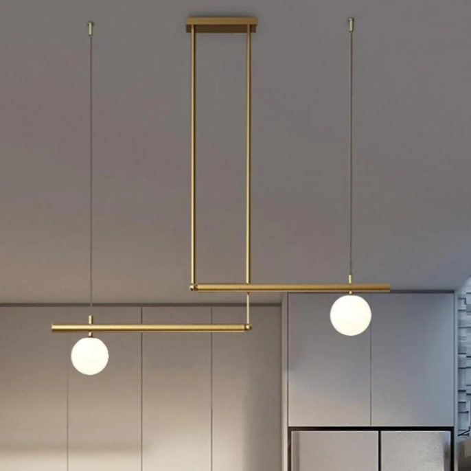 Gold linear pendant light showing asymmetric linear design.