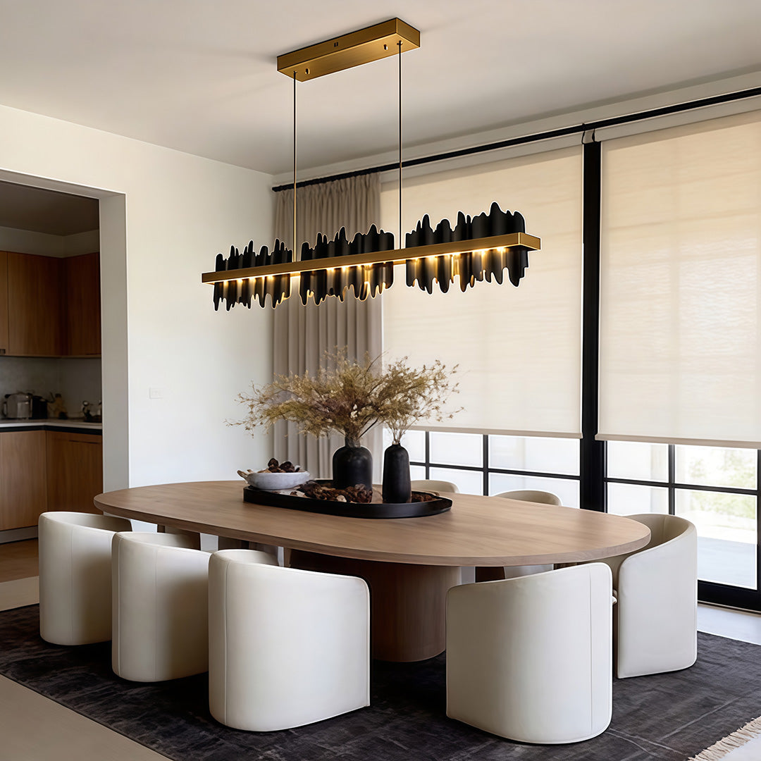 Gold linear pendant light providing elegant illumination above a contemporary dining table.