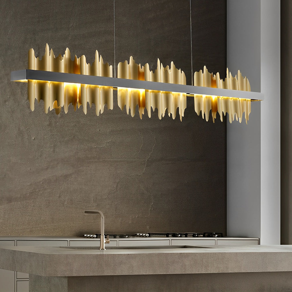 Gold linear pendant light with a minimalist design, installed in a modern living room.