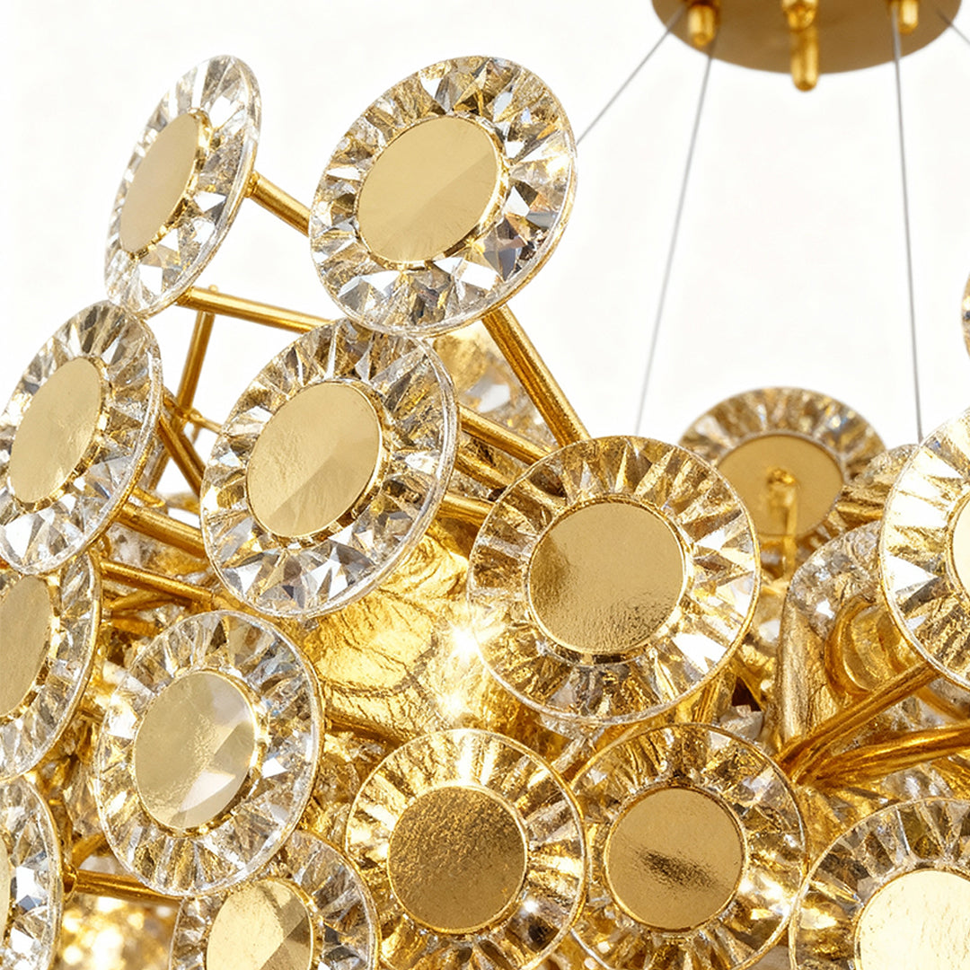 Close-up detail of gold modern chandelier showing intricate floral crystal elements and brass metalwork construction