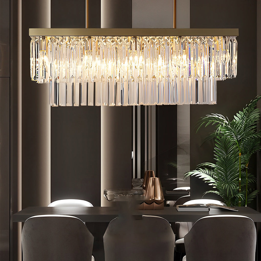 Gold rectangular chandelier with a detailed view of its crystal strands and gold finish.