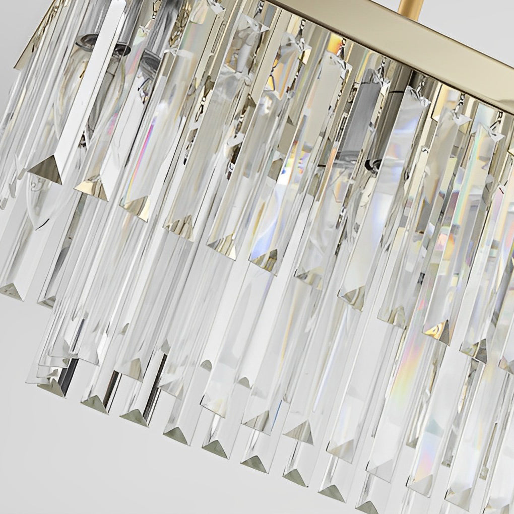 Gold rectangular chandelier with a modern design, enhancing a contemporary interior.