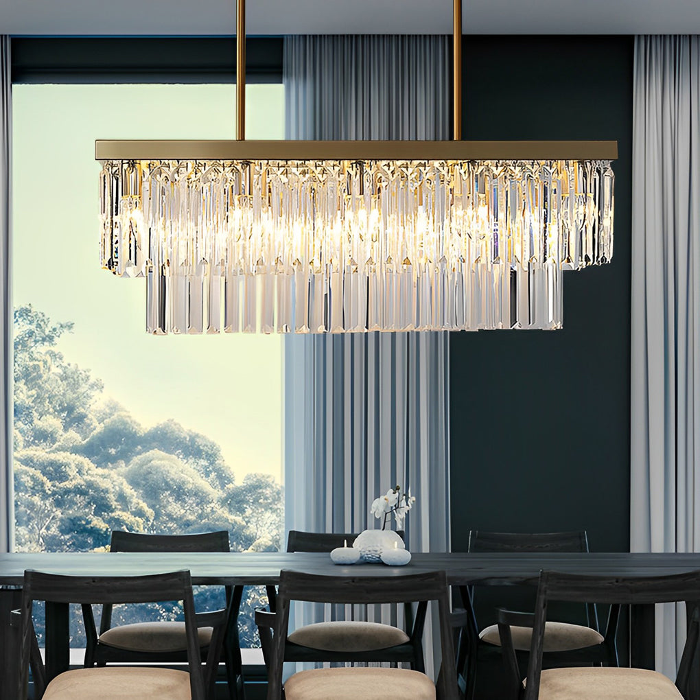 Gold rectangular chandelier with a sleek design, enhancing a stylish dining area.