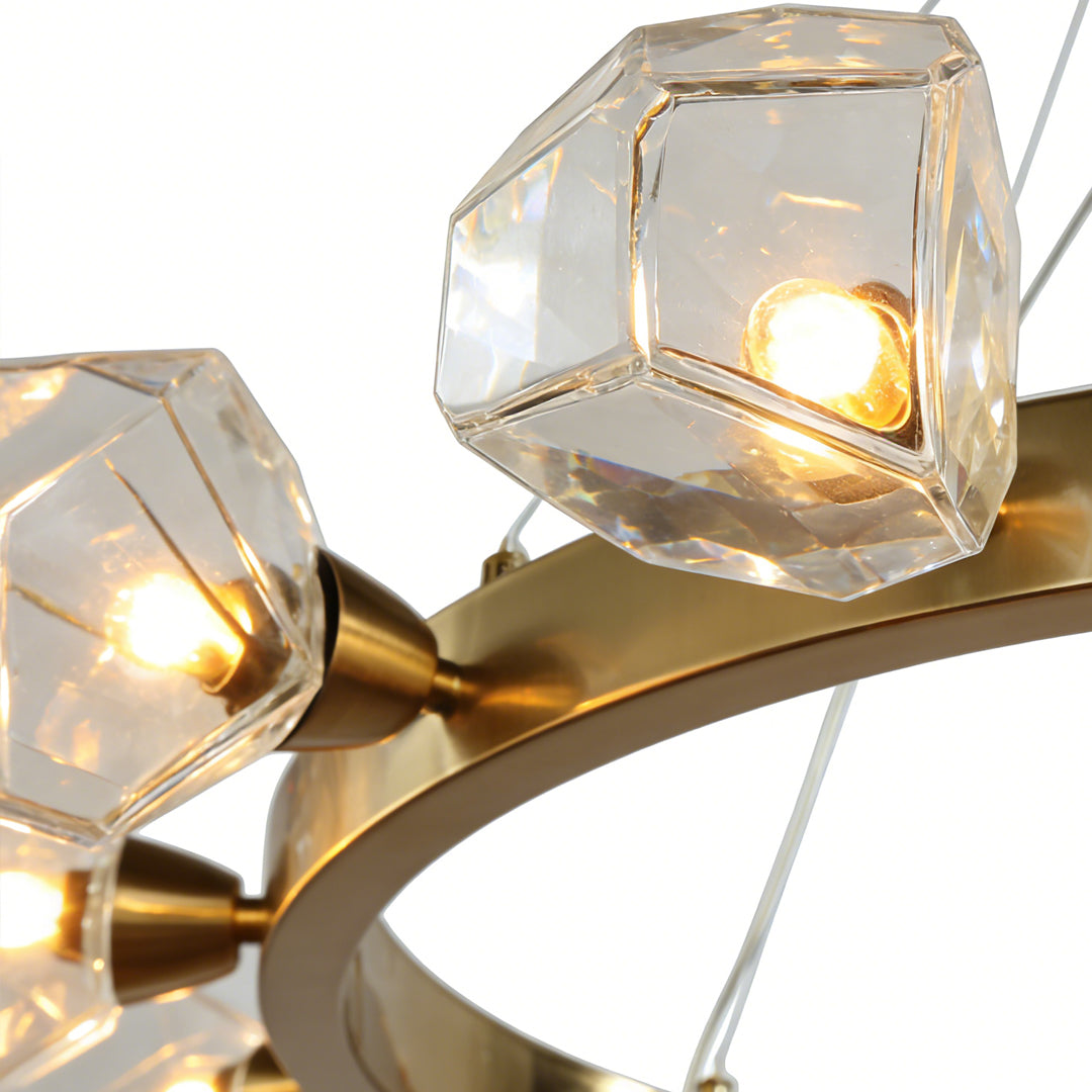 Luxurious gold round chandelier with crystal-clear geometric shades, emitting a warm and elegant glow.