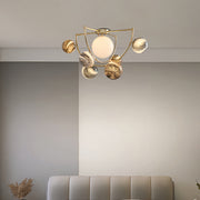 Gold semi flush ceiling light installed in modern dining room creating elegant overhead illumination