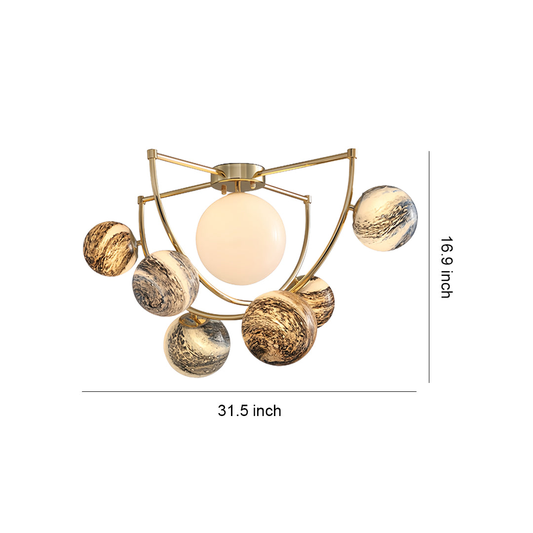 Gold semi flush ceiling light featuring modern geometric design with textured glass spheres and brass framework