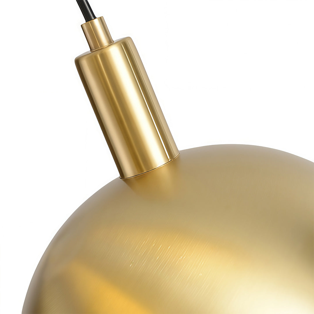 Detailed view of gold sphere pendant light top connector and brushed brass finish.