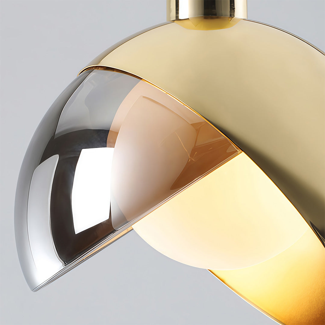 Close-up of gold sphere pendant light shade showing reflective metallic interior finish.