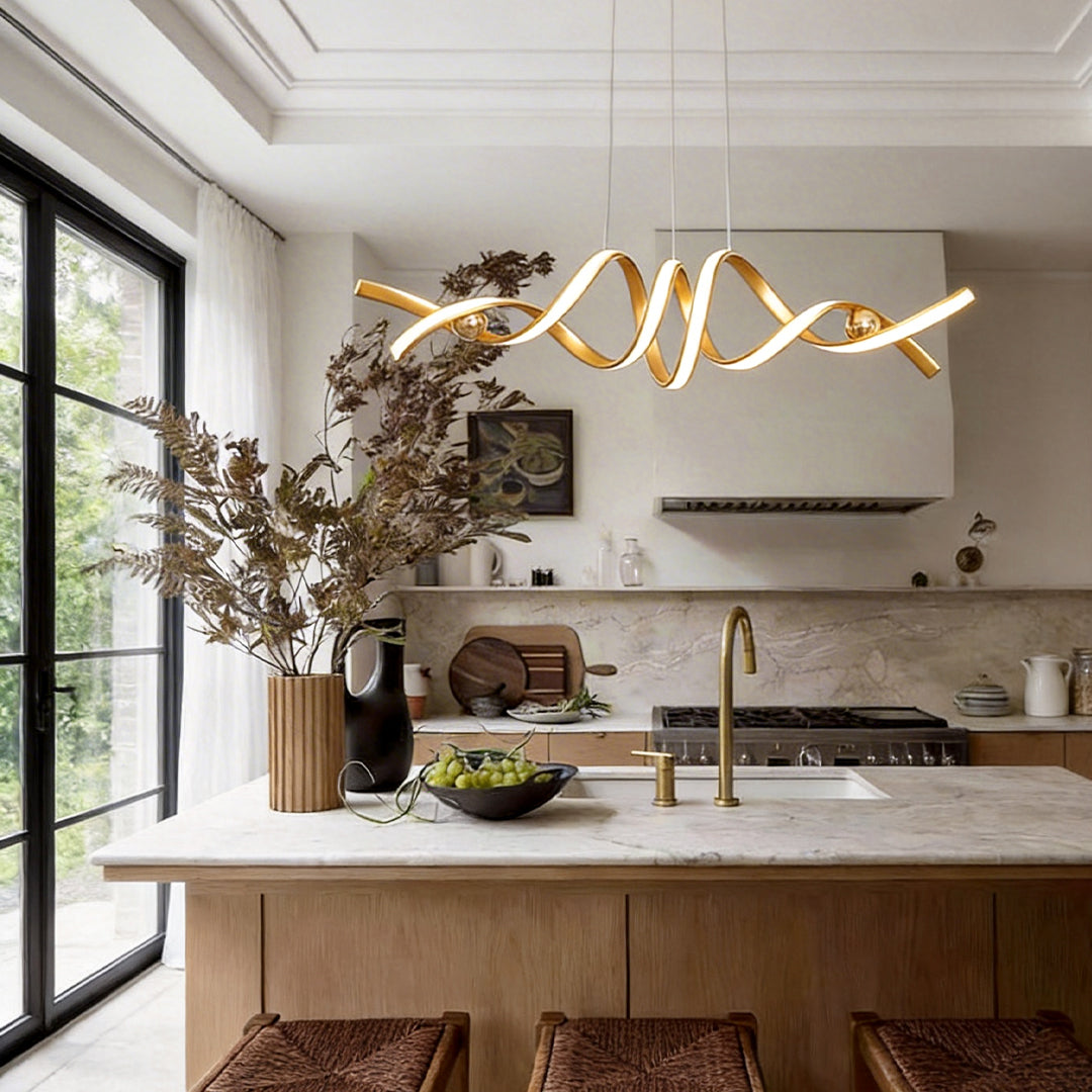 Gold spiral ceiling light installed over a dining table in a bright interior.