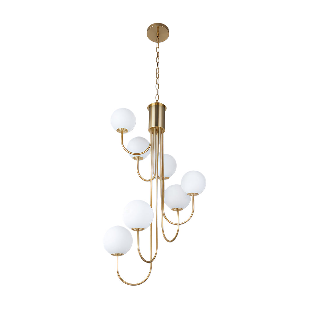 Gold spiral globe chandelier brightening a luxurious room with soft warm light.