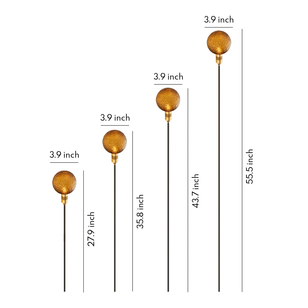 Golden globe stake light with warm glow, ideal for decorative garden path landscape lighting.