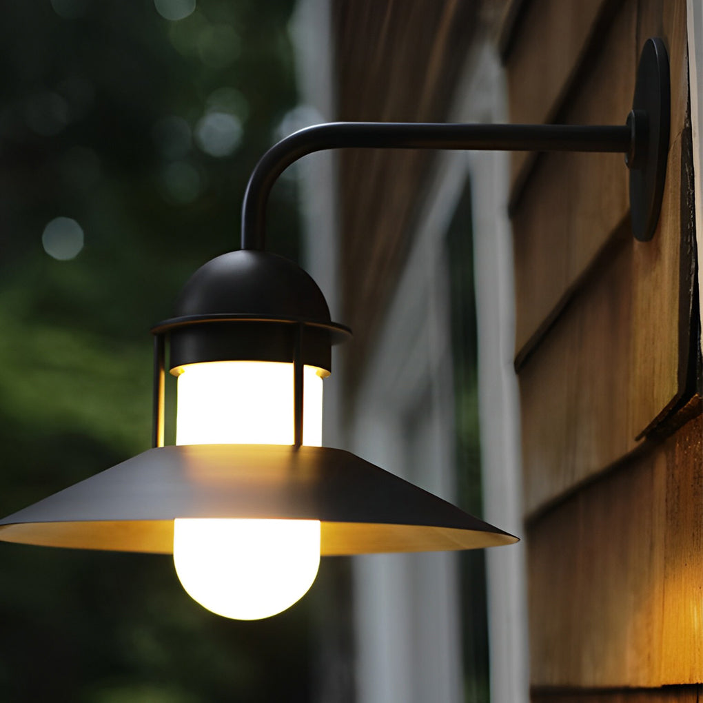 Gooseneck wall light fixtures with a close-up of their sleek black finish and glass shade.