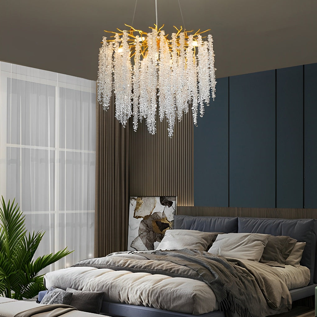 Gorgeous modern gold crystal chandelier creating a warm ambiance in a cozy modern bedroom.