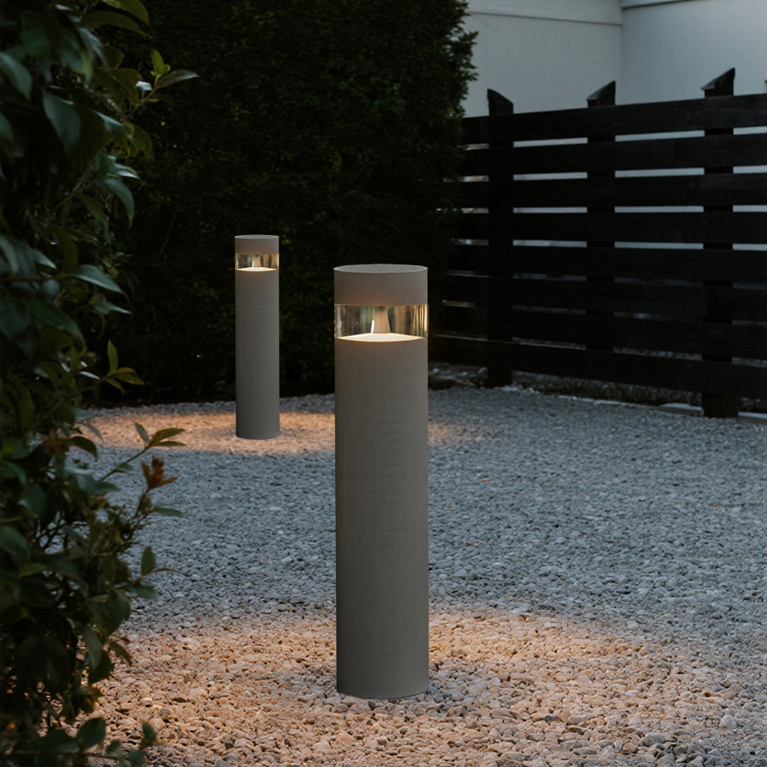 Pathway lights outdoor illuminating gravel surface creating elegant evening ambiance for residential outdoor spaces