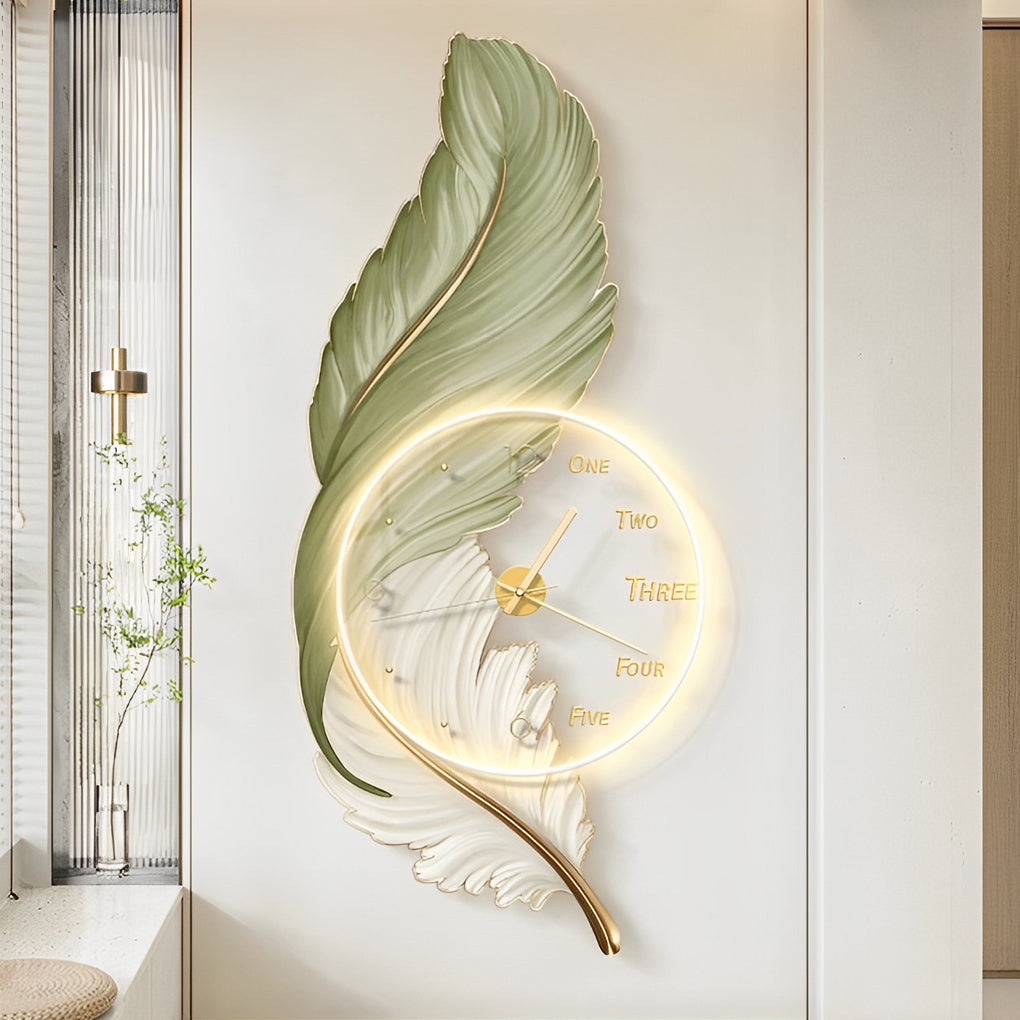 Green feather LED wall lamp with integrated clock displayed in a bright interior space.