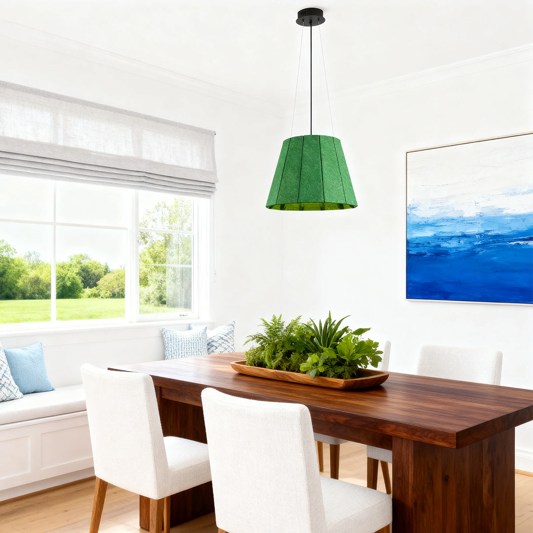 Green felt industrial pendant light fixture suspended over a rustic dark wood dining table in a bright, farmhouse-style room. 