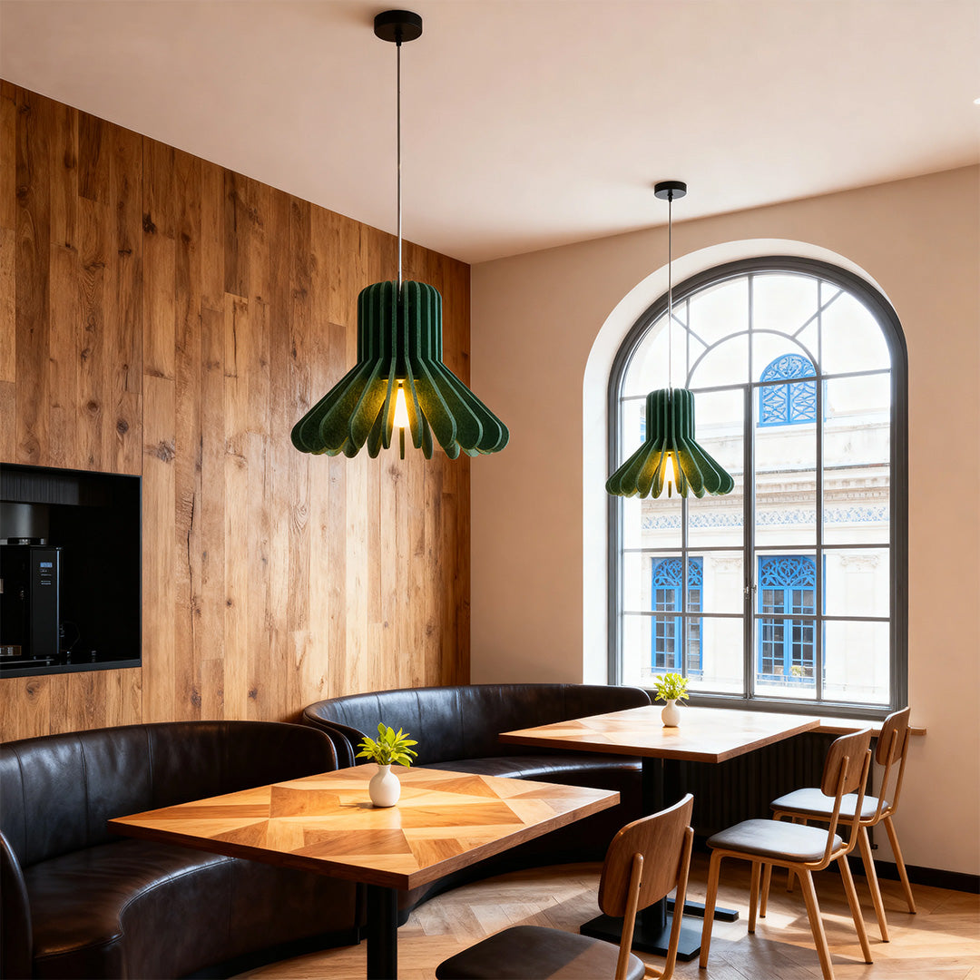 Pair of green felt tiny pendant lights over a corner booth in a cozy restaurant setting