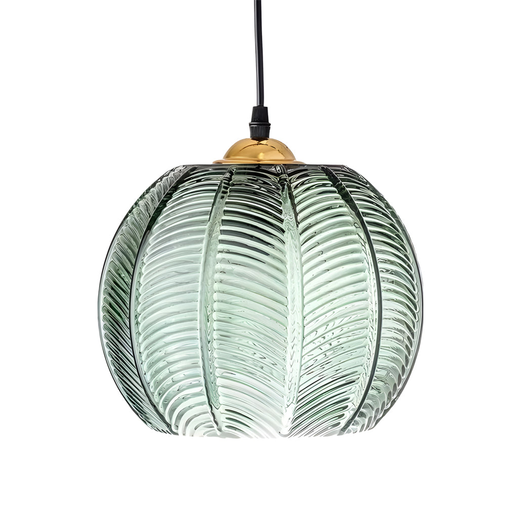 Close-up of a green glass pendant light showing ribbed glass texture and brass detail.