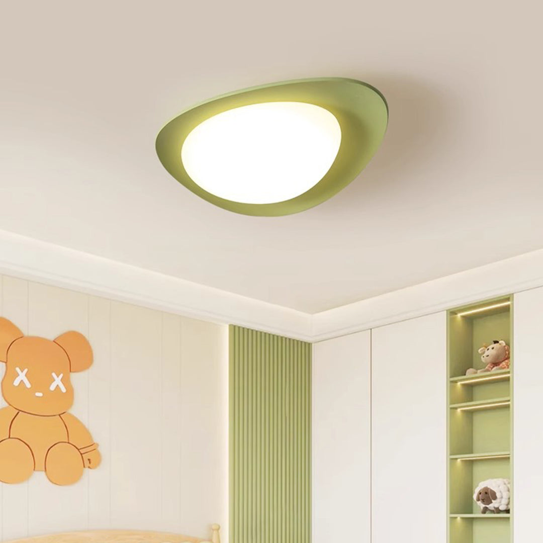 Green pebble ceiling light providing accent lighting in contemporary minimalist room