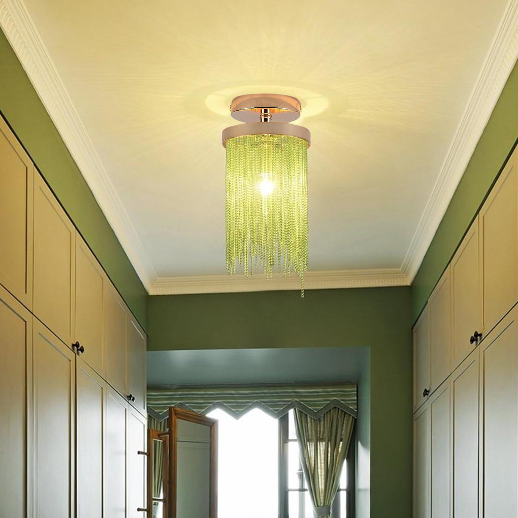Green tassel chandelier flush mount illuminating a long hallway with green walls and classic trim.