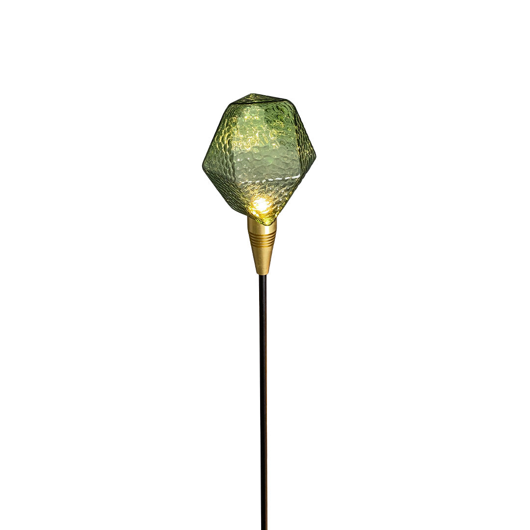 Green textured outdoor stake globe light with golden base, enhancing garden areas as landscape lighting pathway.