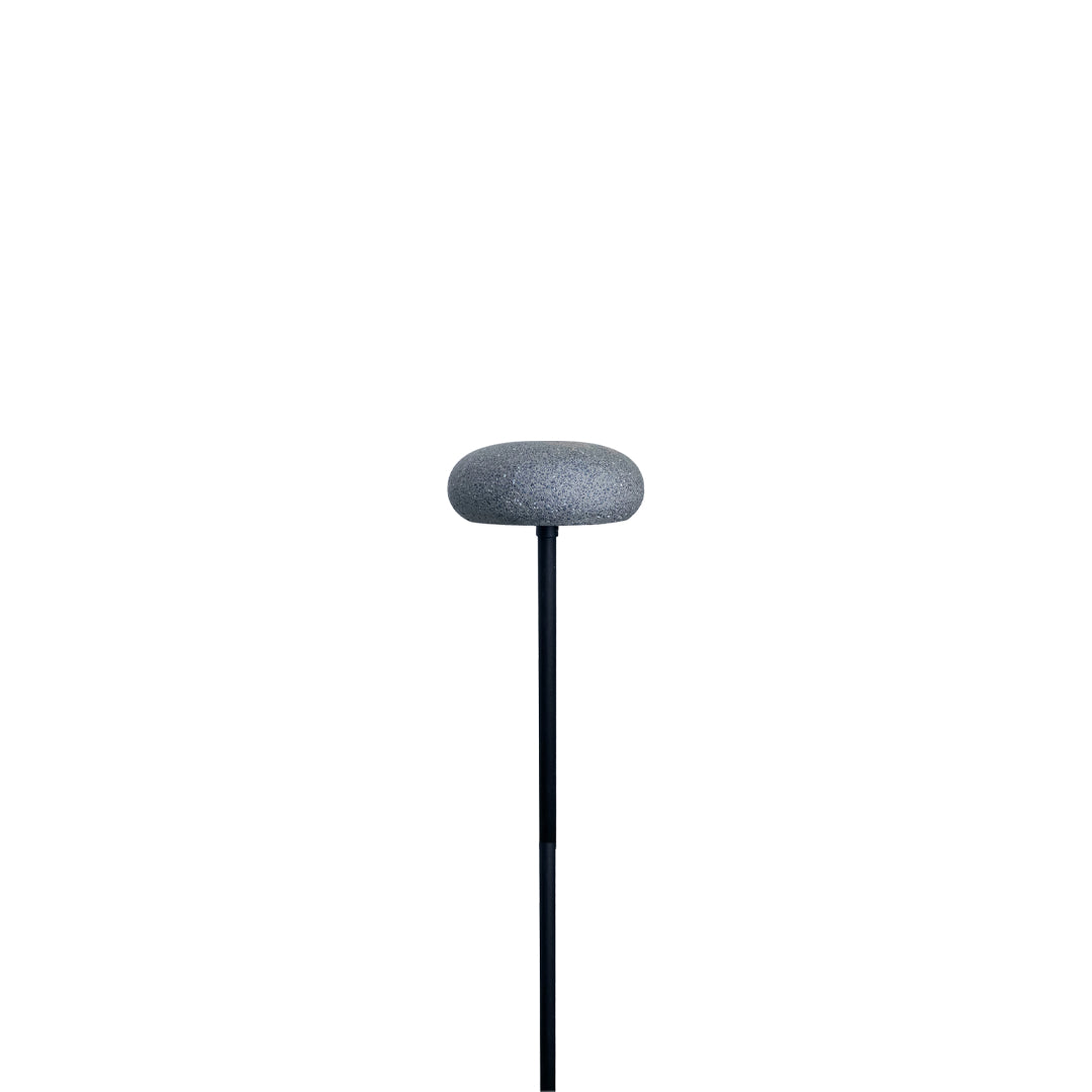 Modern mushroom pathway light in grey color with round top and slender post on white background.