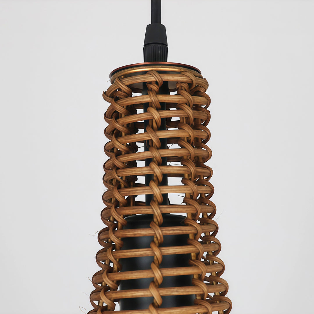 Group of rattan pendant lights hanging above a dining area, creating a stylish and inviting atmosphere.