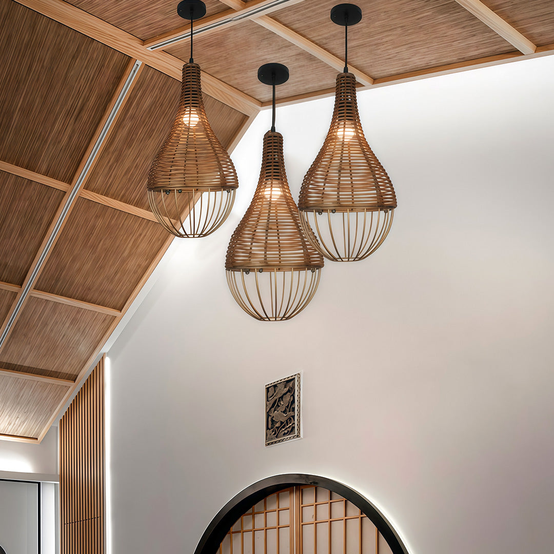 A group of rattan pendant lights hanging in a contemporary dining room, enhancing the natural decor.
