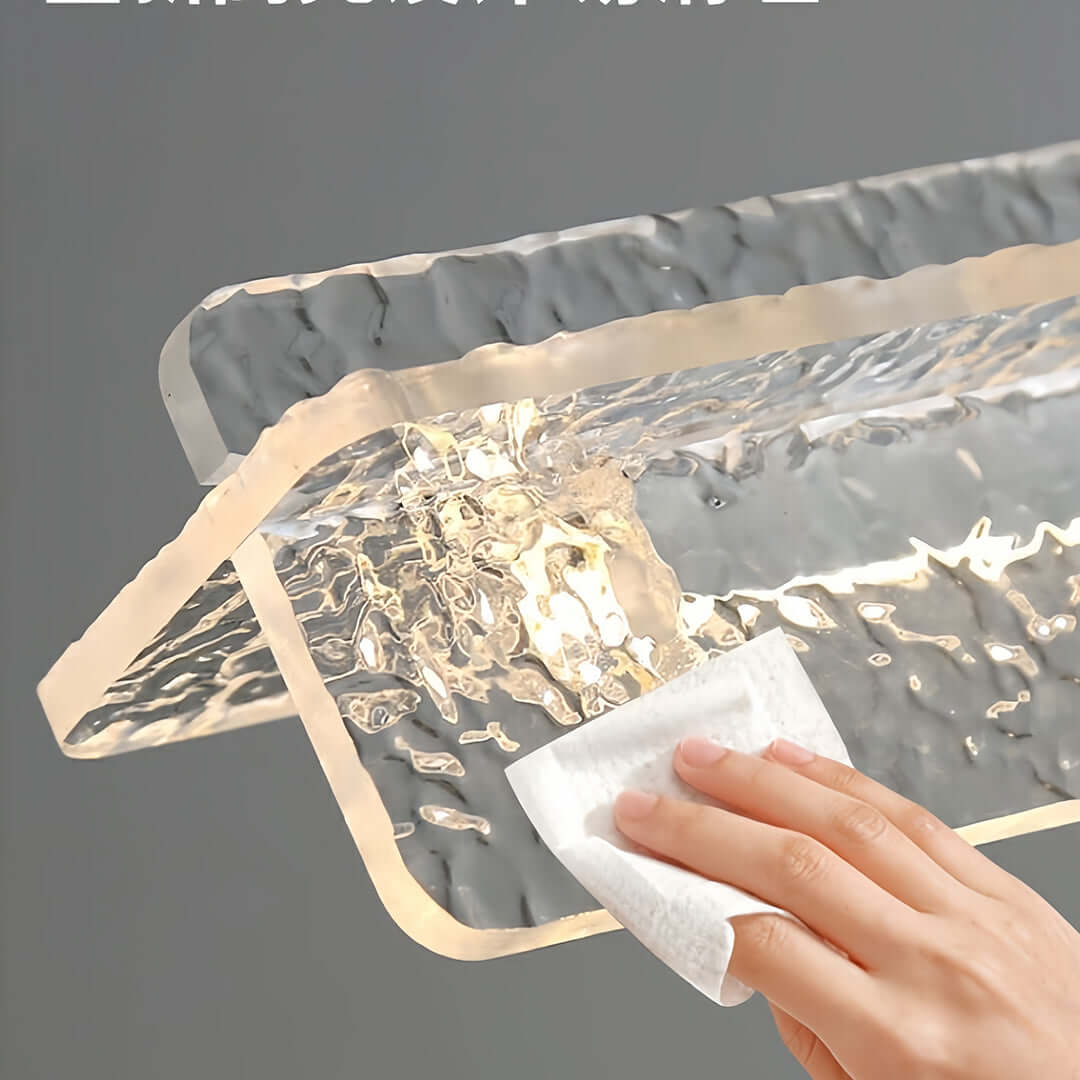 Demonstration of the hand-wiping process for easy cleaning of the bubble glass modern white pendant light.
