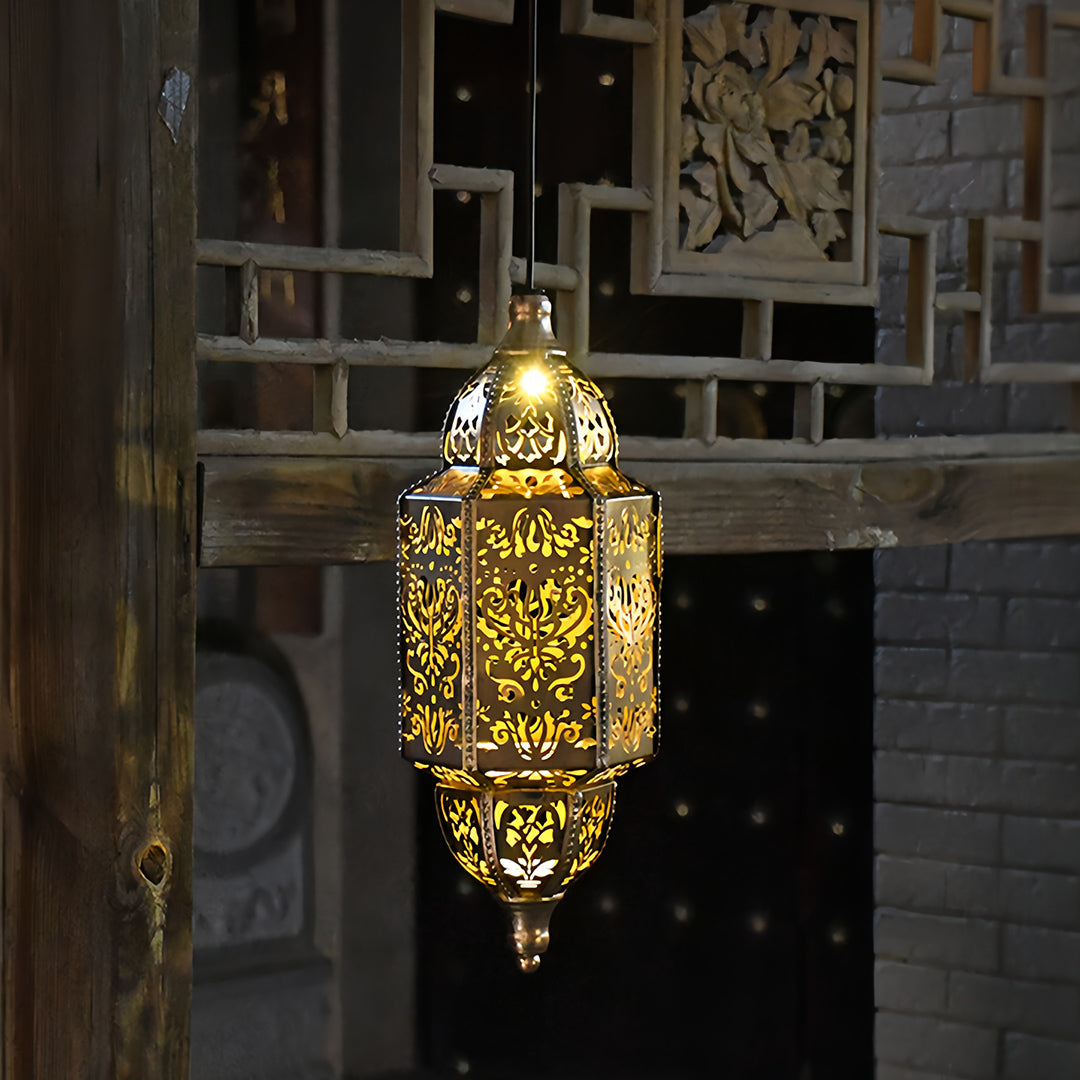 Hanging brass-finish outdoor moroccan lanterns suspended from a wooden pergola for patio illumination.