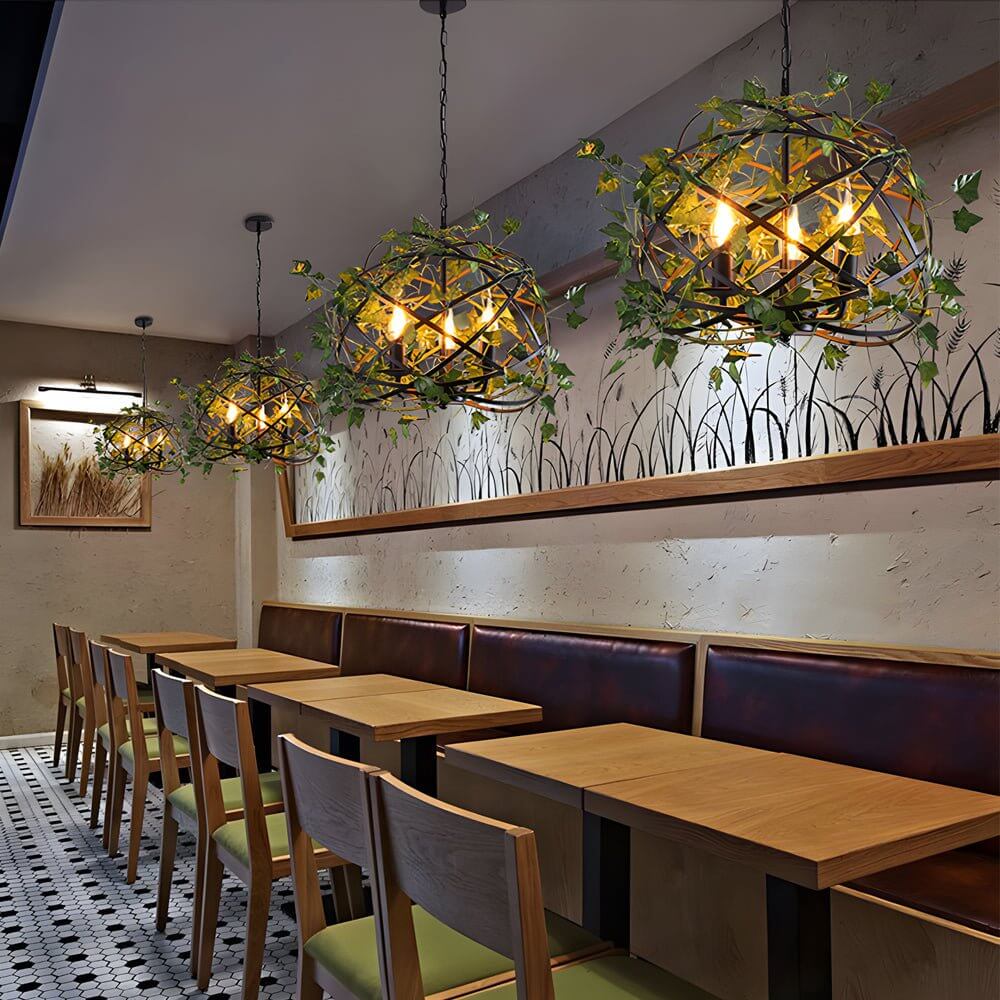 Hanging greenery with lights providing a festive atmosphere in a garden party setup.