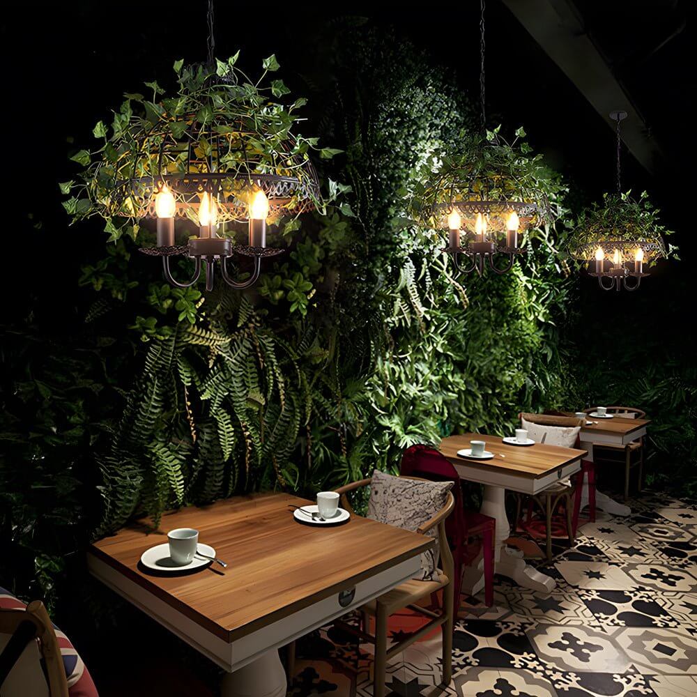 Hanging greenery with lights enhancing a wedding venue with soft, warm illumination.