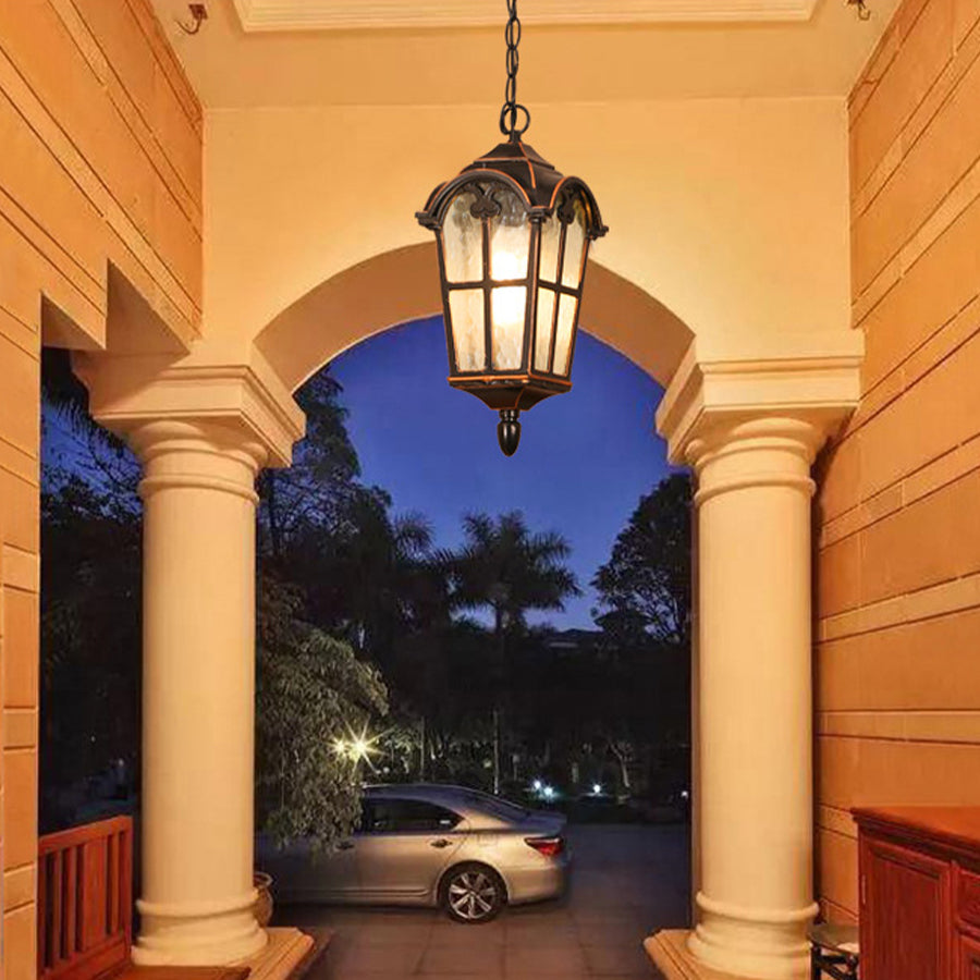 Elegant hanging lantern suspended from arched colonnade creating dramatic entrance lighting