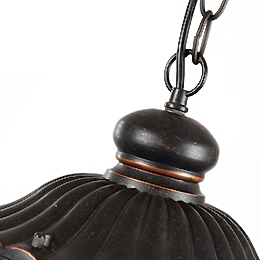 Top portion of hanging lantern showing chain attachment and decorative cap details