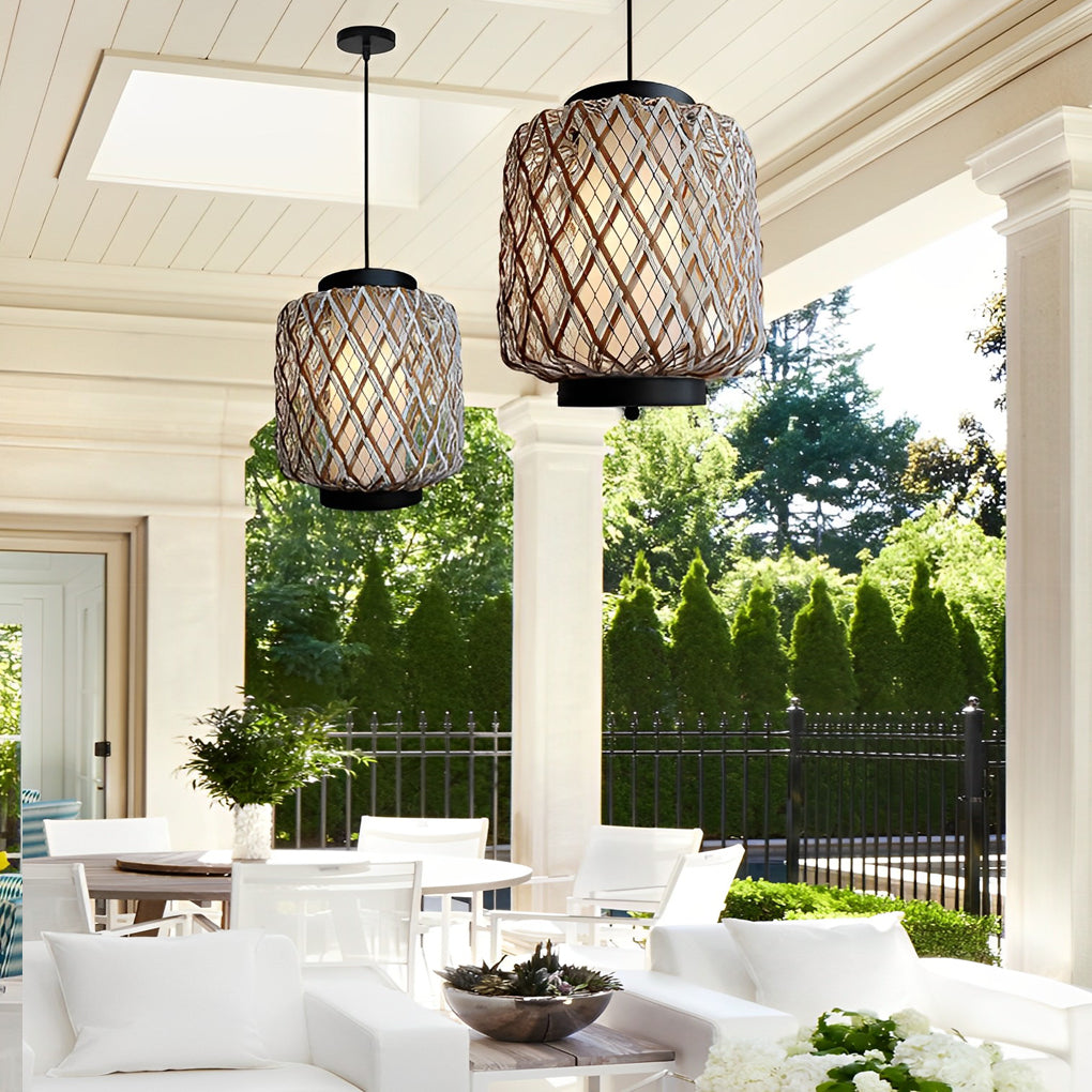 Hanging lantern lamp casting warm light over patio dining area.
