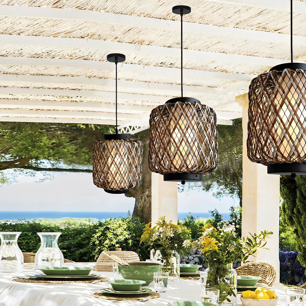Hanging lantern lamp with woven pattern over outdoor dining table.