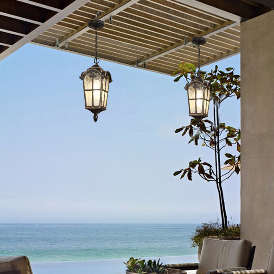 Multiple hanging lanterns creating atmospheric lighting in outdoor coastal dining area