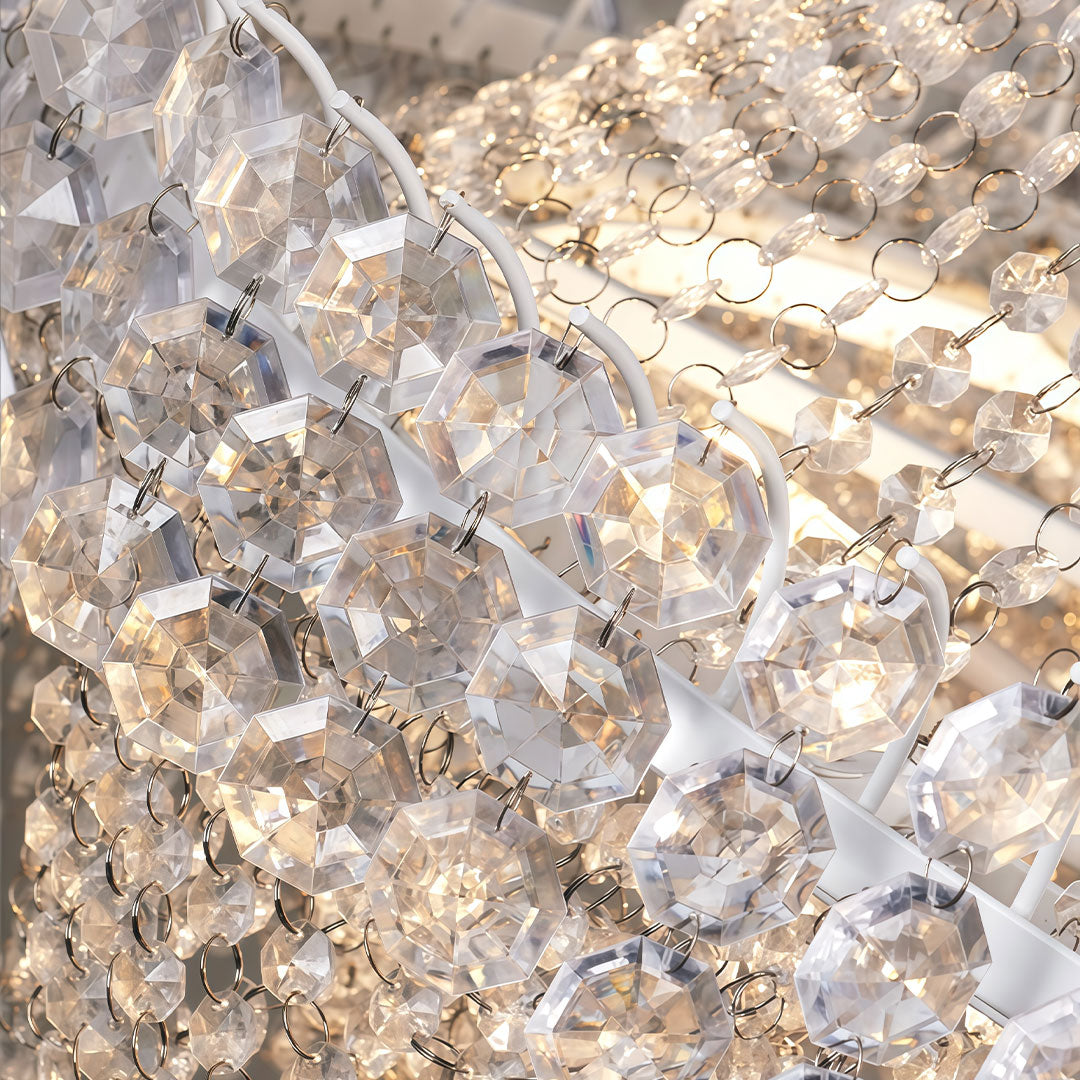 Hanging light outdoor with crystal details, enhancing a garden wedding setup.