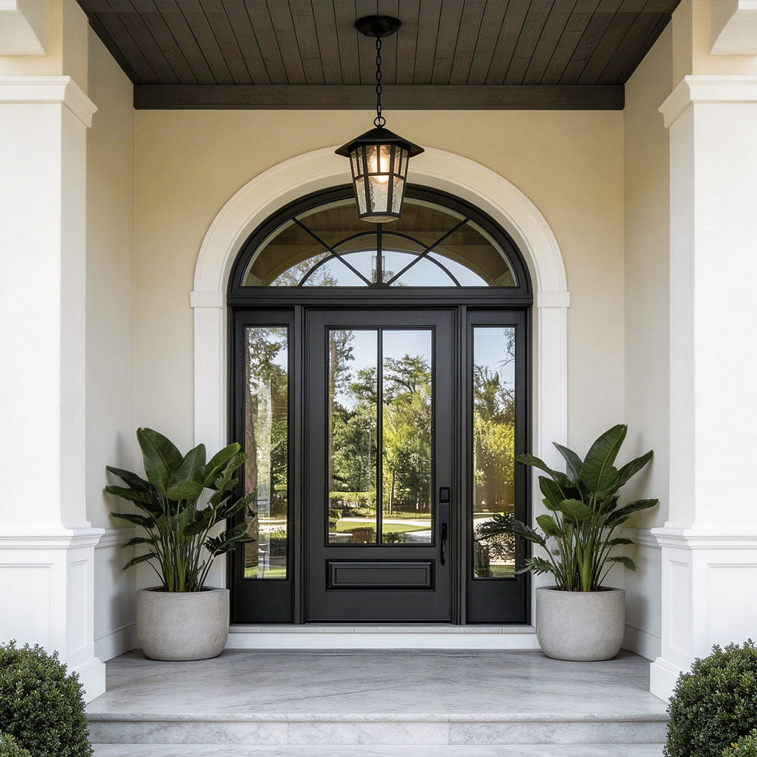 Hanging outdoor light with a classic design, mounted above a modern arched doorway.