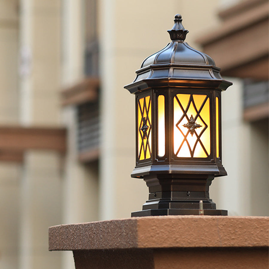 Heritage-style outside pillar light with lattice glass pattern installed on wooden post for traditional outdoor ambiance