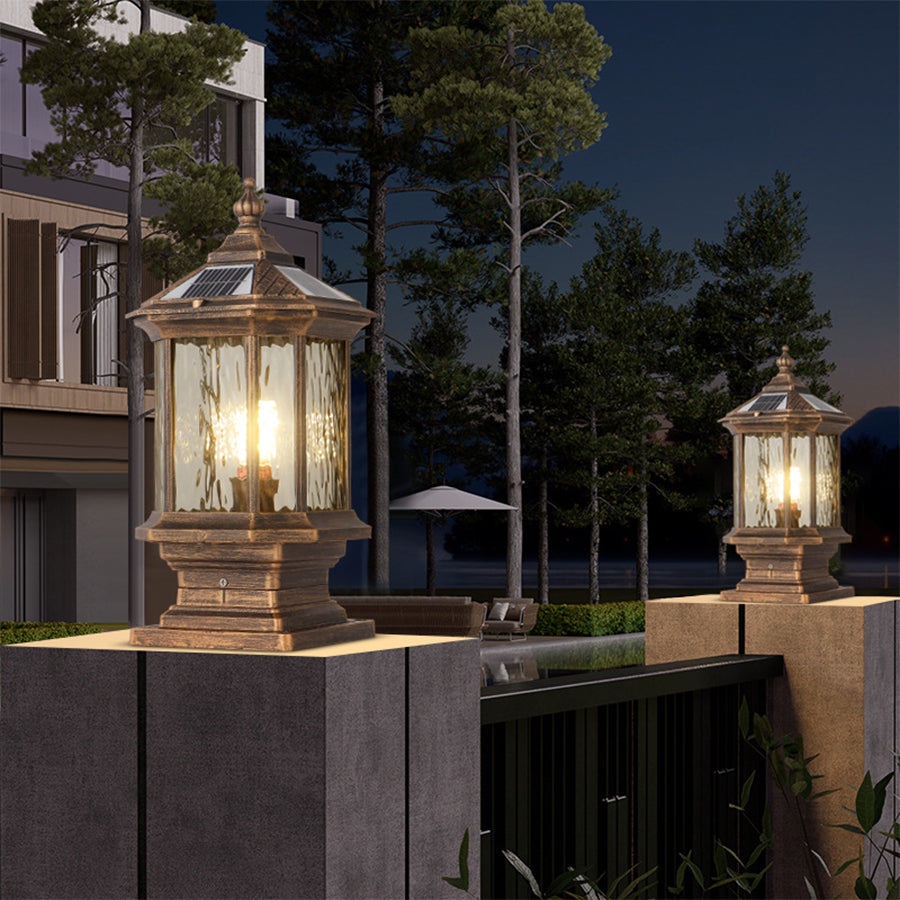 Pair of heritage-style post lights illuminating landscaped entrance with evening twilight atmosphere